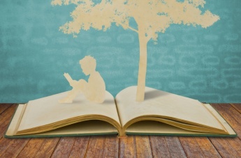 silhouettes-of-a-tree-and-a-man-on-a-book_1232-292