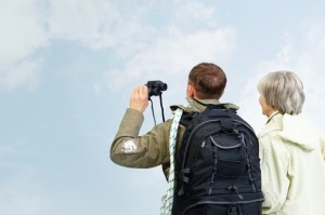 couple-looking-at-the-blue-sky-with-binoculars_1098-1706